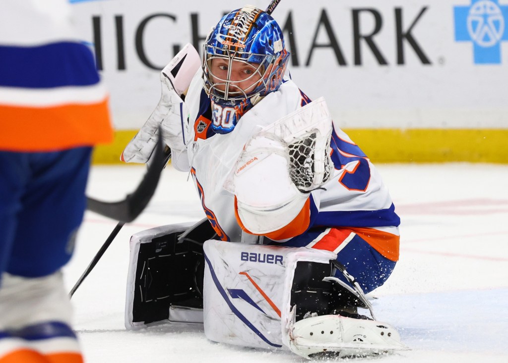 Ilya Sorokin, making a glove save during a recent game, needs more help from the Islanders defense for the playoff stretch run.