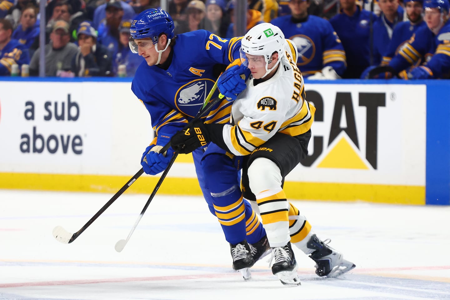 Bruins rookie James Hagens (right) was thrown right into the playoff fire, battling imposing Sabres center Tage Thompson in Sunday's Game 1 up in Buffalo.
