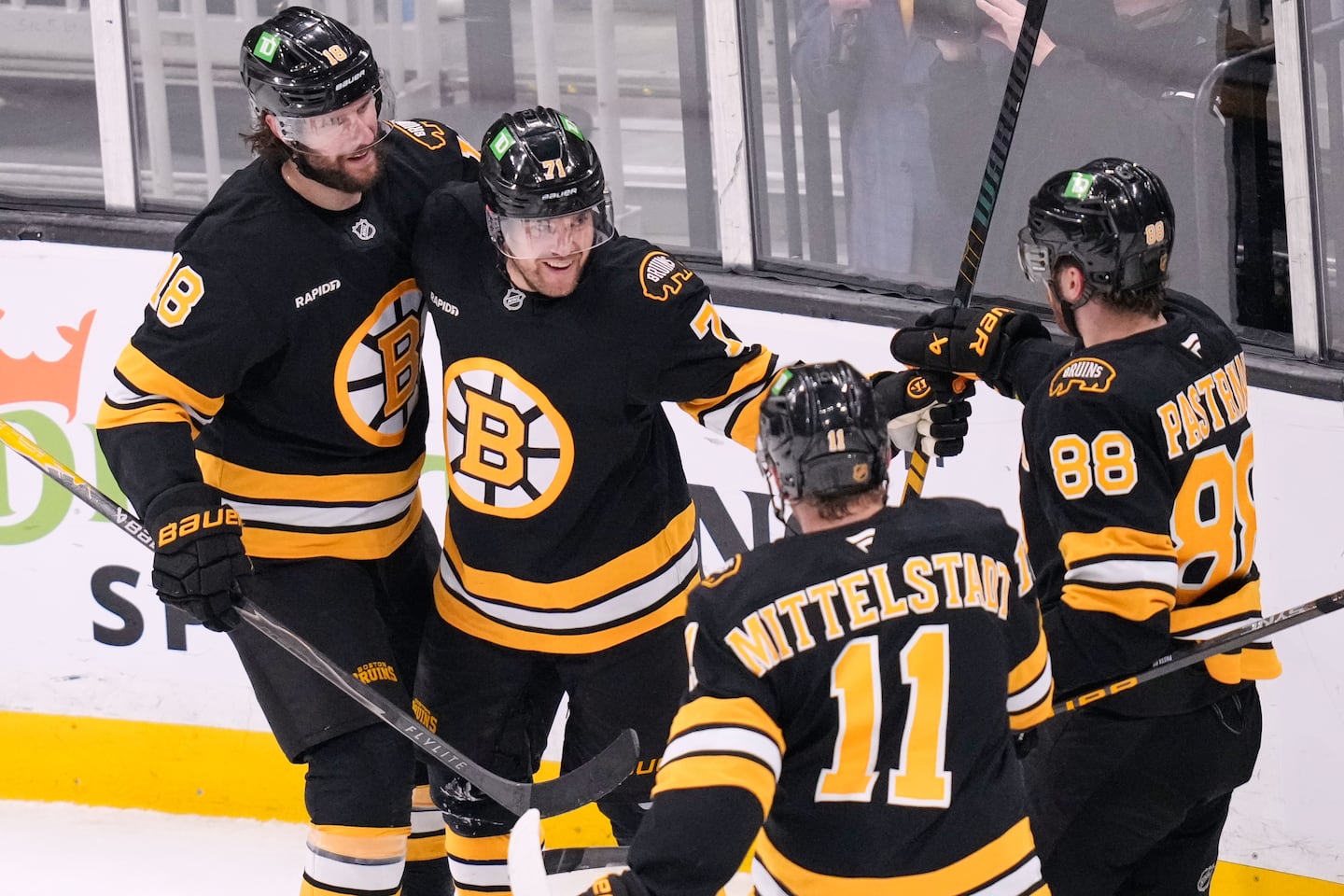 Bruins left wing Viktor Arvidsson is the center of a celebration after his first-period goal against Stars goaltender Jake Oettinger for a 2-0 lead Tuesday night at TD Garden.