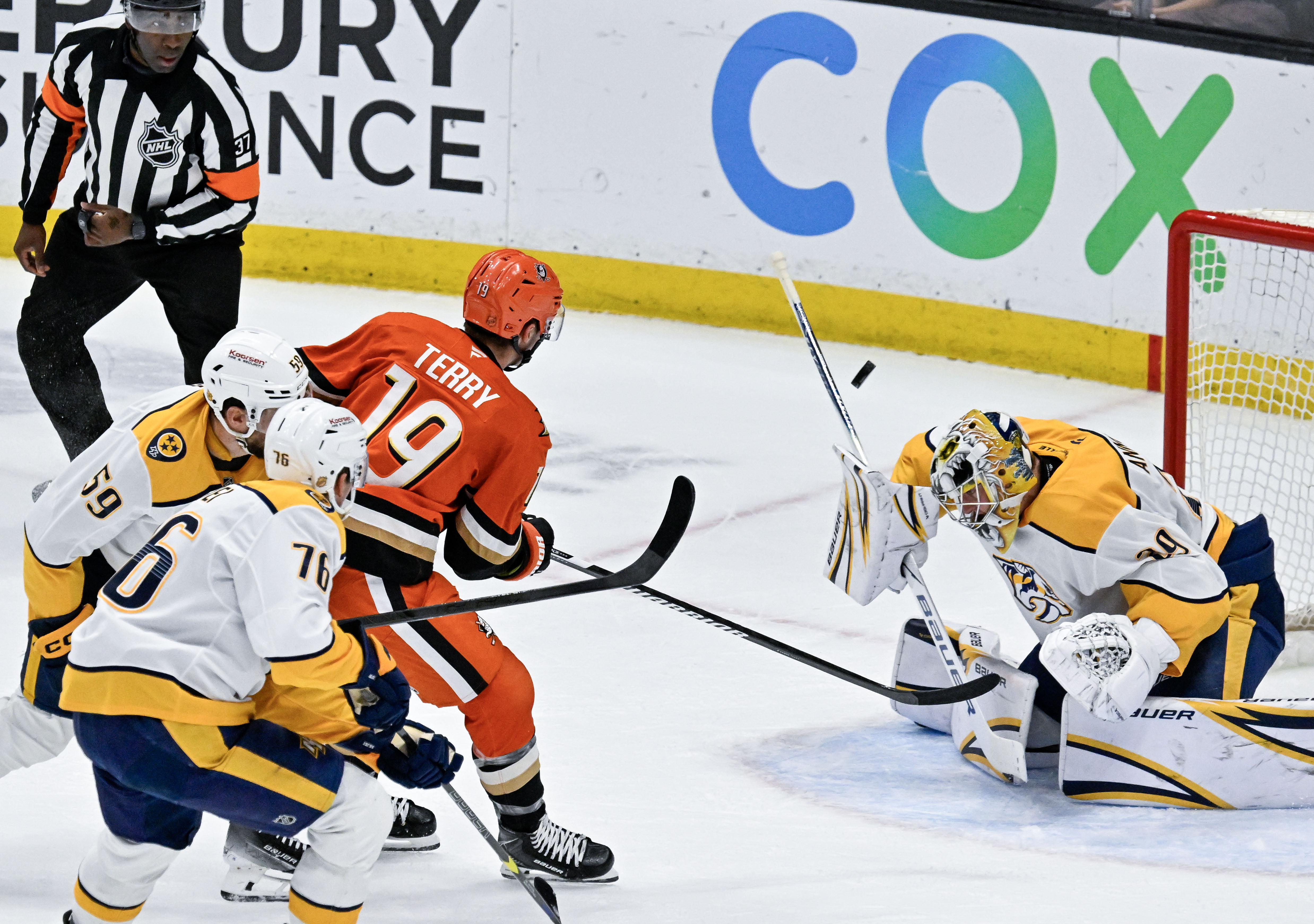 The Ducks’ Troy Terry (19) takes a shot on goal...