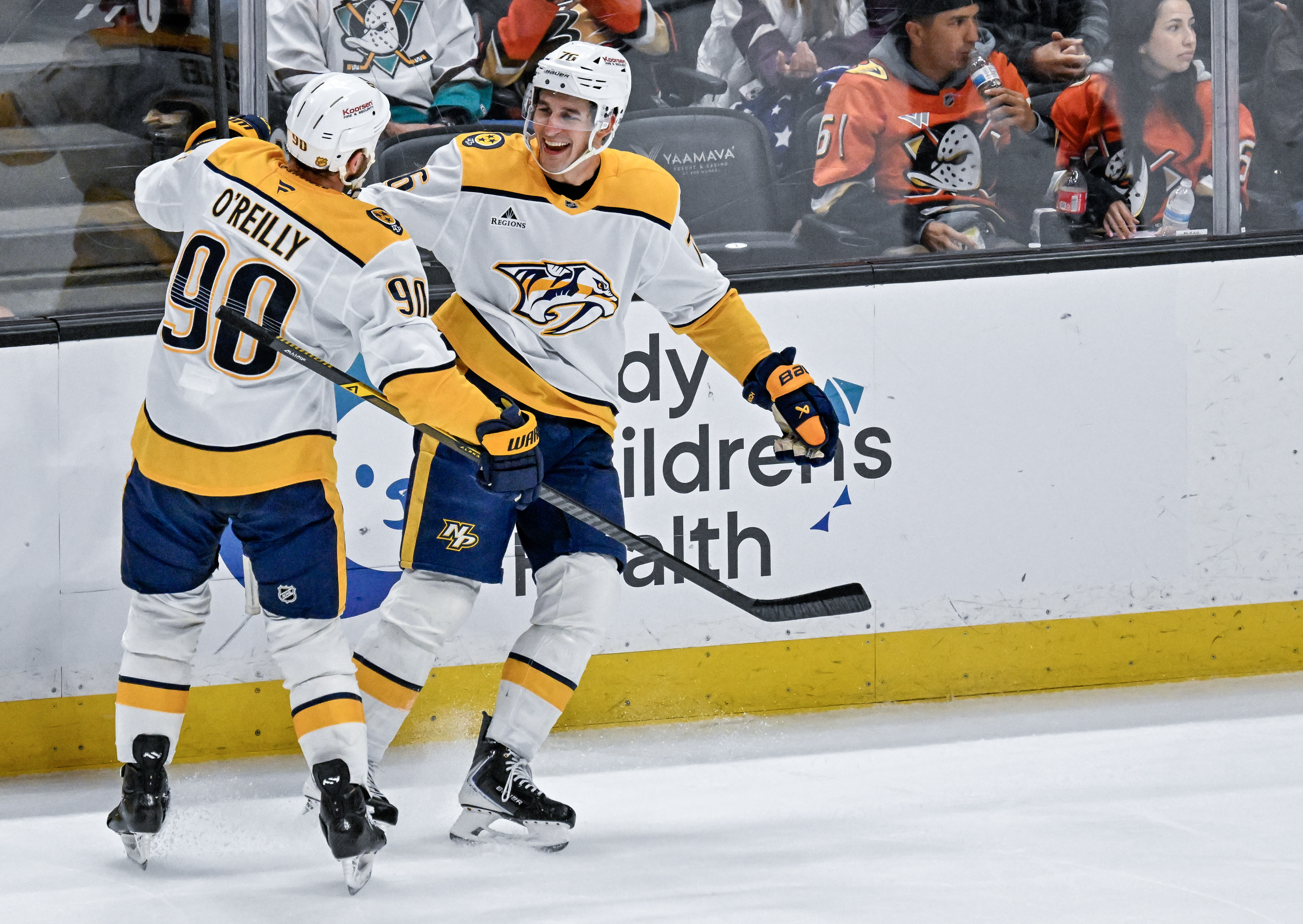 The Nashville Predators’ Ryan O’Reilly, left, celebrates a goal by...