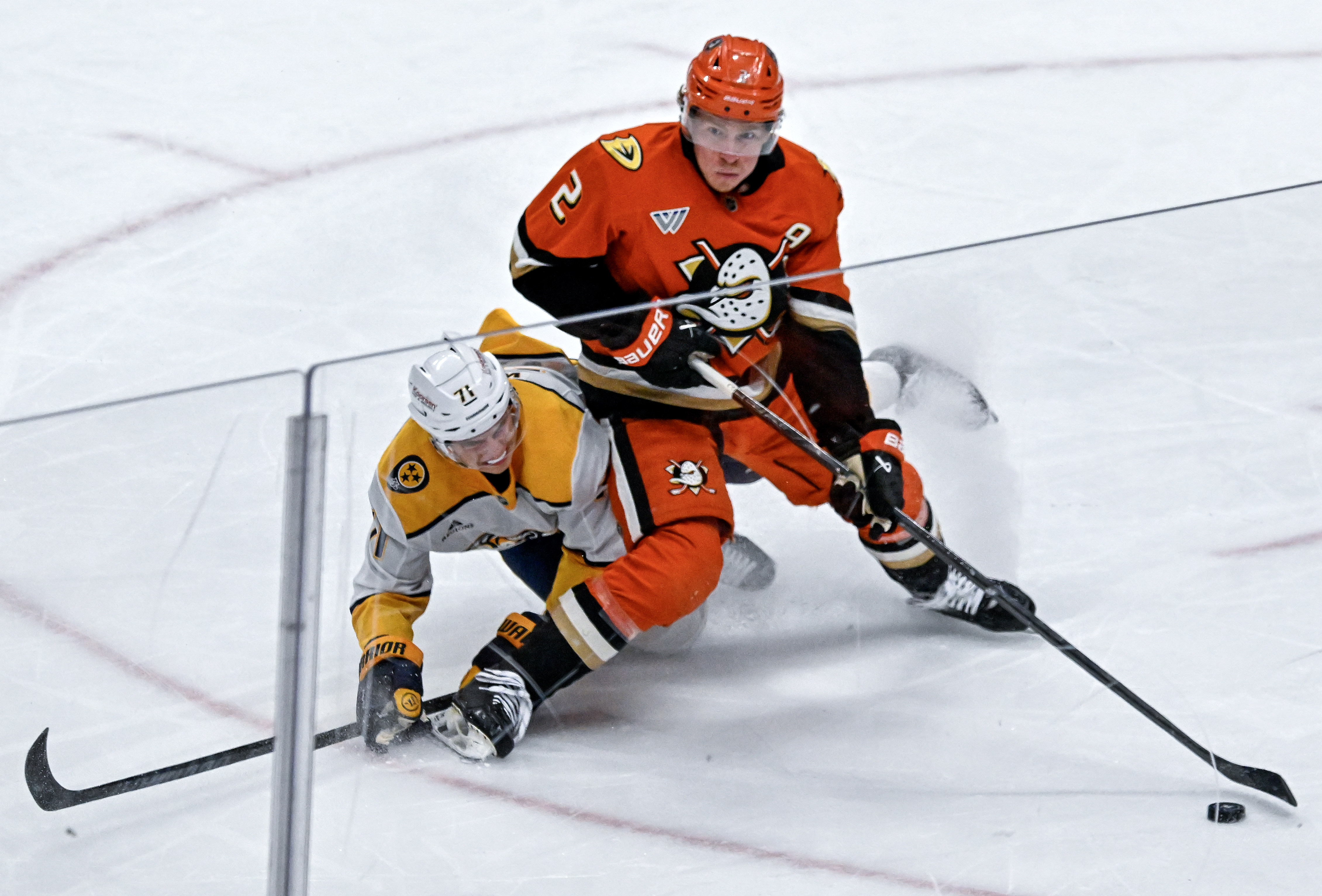 The Ducks’ Jackson LaCombe controls the puck during the second...