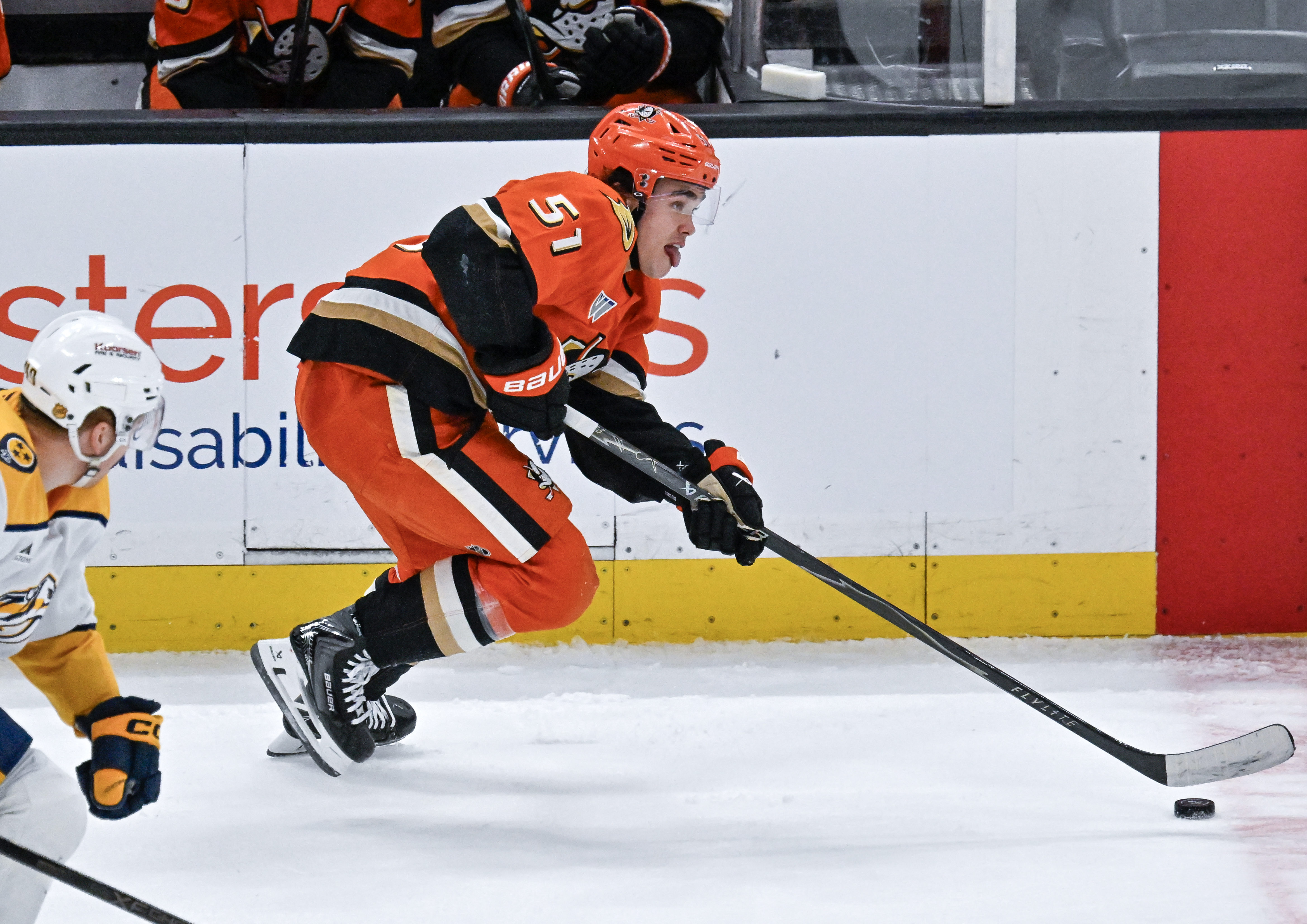 The Ducks’ Olen Zellweger controls the puck during the third...