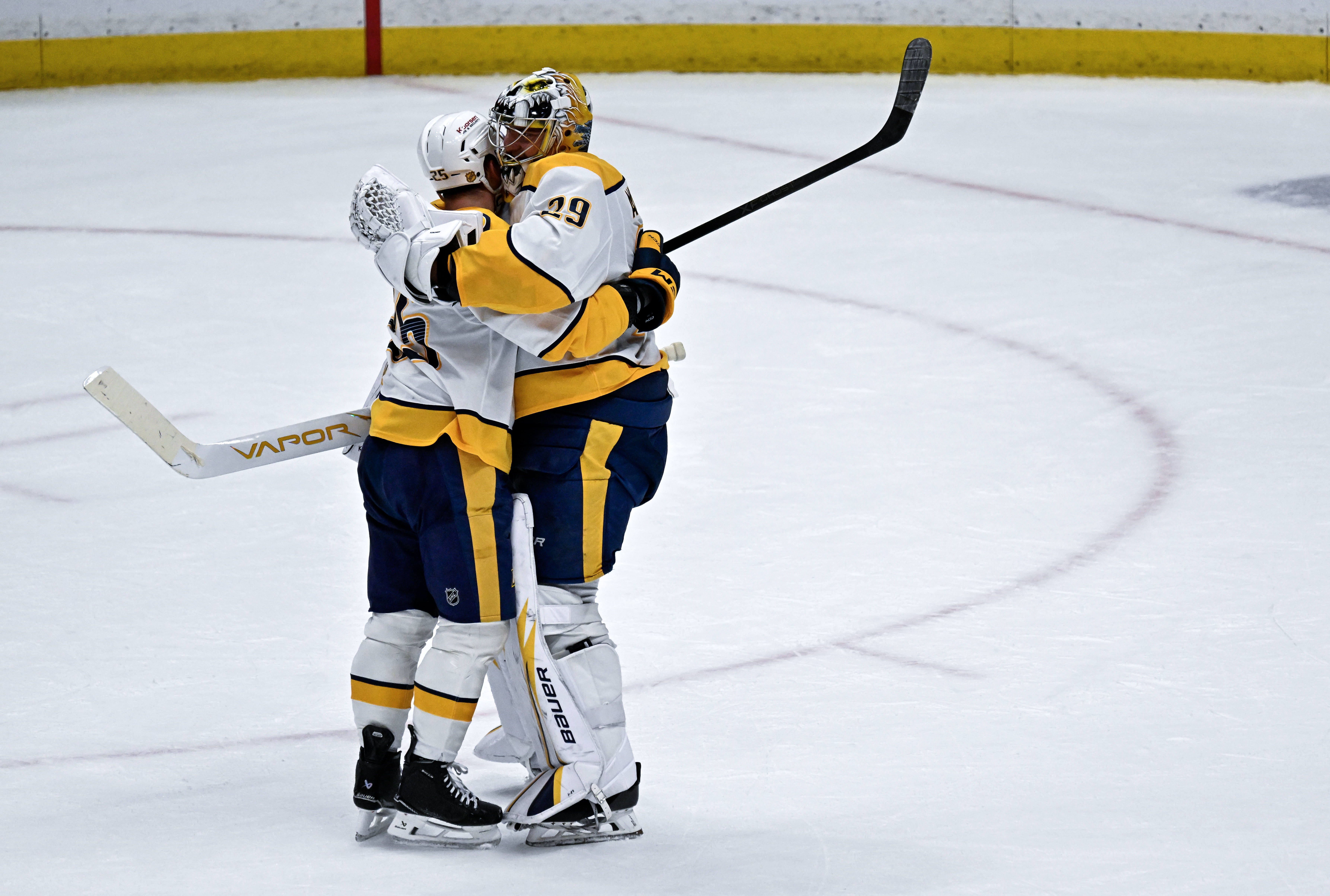 Nashville Predators goaltender Justus Annunen, right, celebrates with right wing...