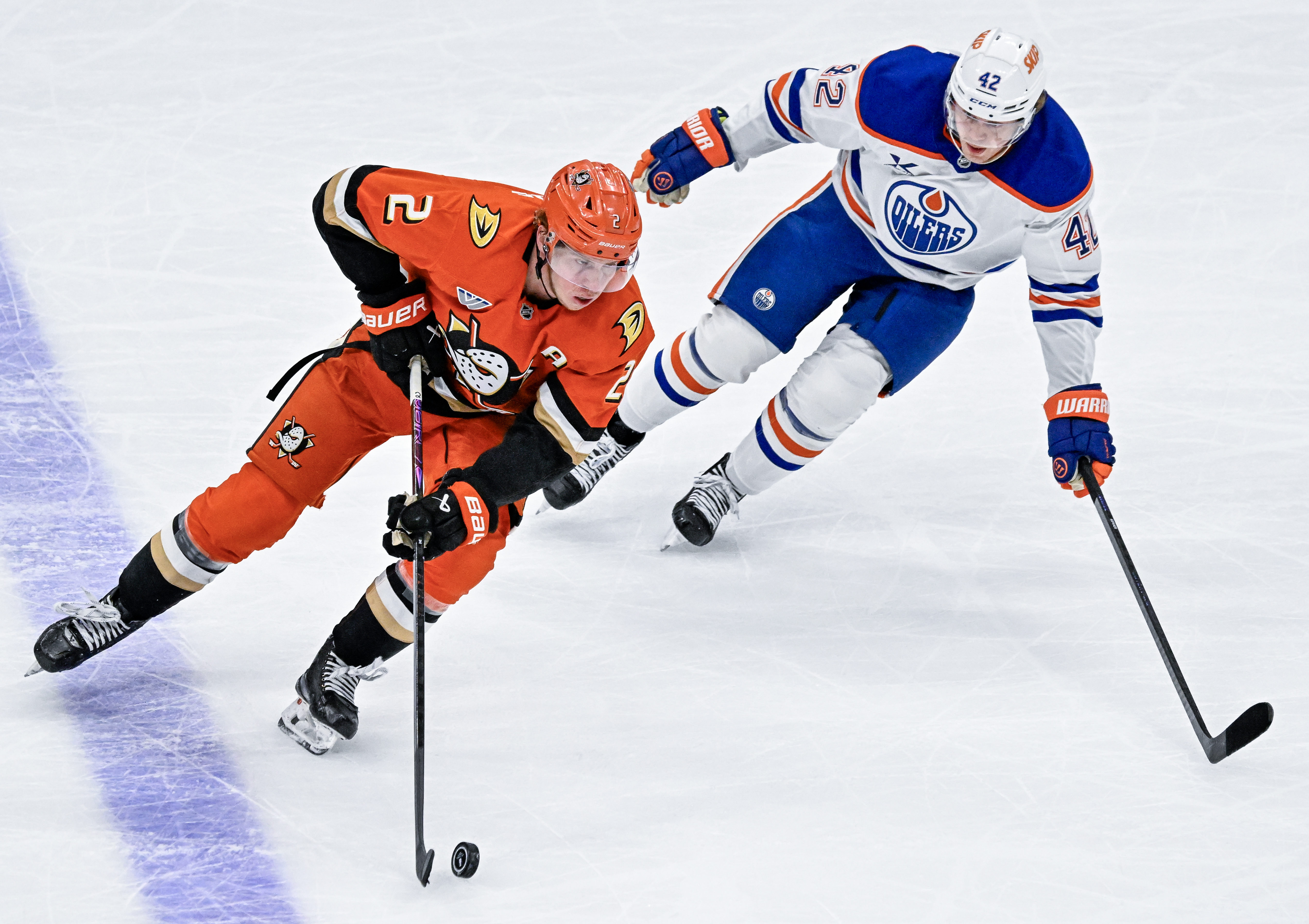 The Ducksâ Jackson LaCombe (2) controls the puck during the...