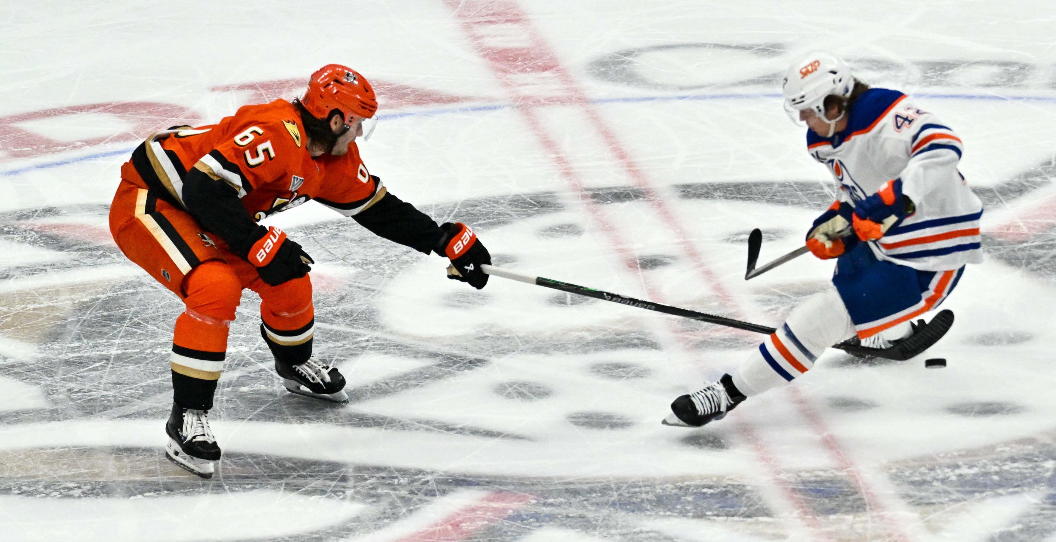 The Ducks Jacob Trouba (65) and Edmonton Oilers Kasperi Kapanen...