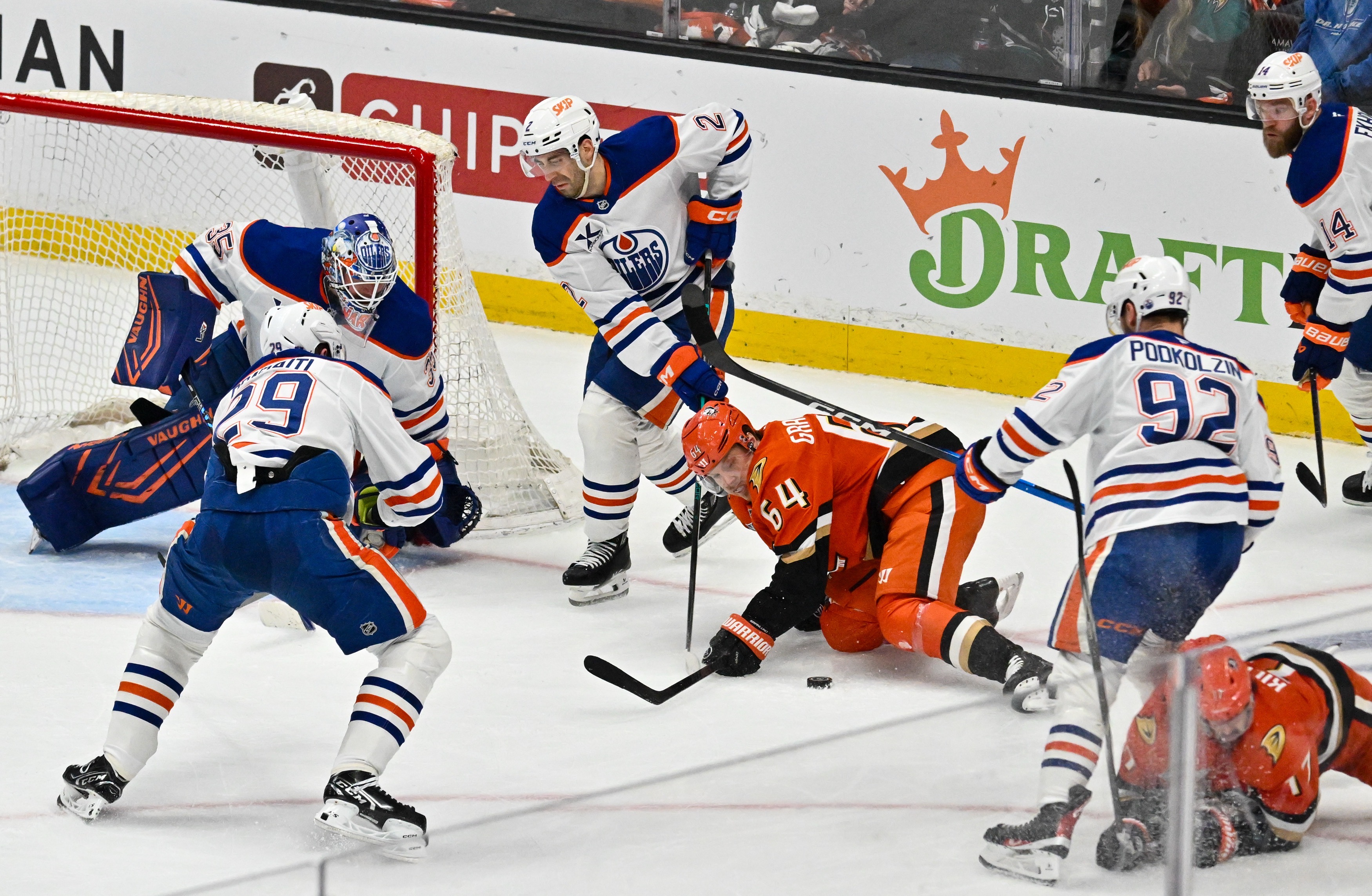 The Ducks Mikael Granlund (64) scrambles for the puck in...