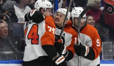 Philadelphia Flyers right wing Owen Tippett (74) celebrates his goal against the Tampa Bay Lightning with right wing Travis Konecny (11) and defenseman Jamie Drysdale (9) during the third period of an NHL hockey game Thursday, Nov. 7, 2024, in Tampa, Fla. (AP Photo/Chris O'Meara)