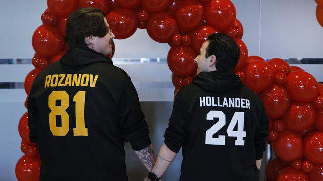 Austin Lee, left, and Nate Cooper pose for a photo in Heated Rivalry themed sweatshirts during Florida Panthers Pride Night on Tuesday, March 31, 2026, at Amerant Bank Arena in Sunrise, Fla.