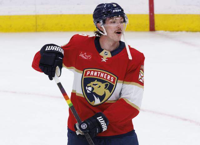 Florida Panthers defenseman Donovan Sebrango (6), the only Florida Panthers to wear Pride tape on his stick, hits the puck during warmups of Florida Panthers Pride Night on Tuesday, March 31, 2026, at Amerant Bank Arena in Sunrise, Fla. 
