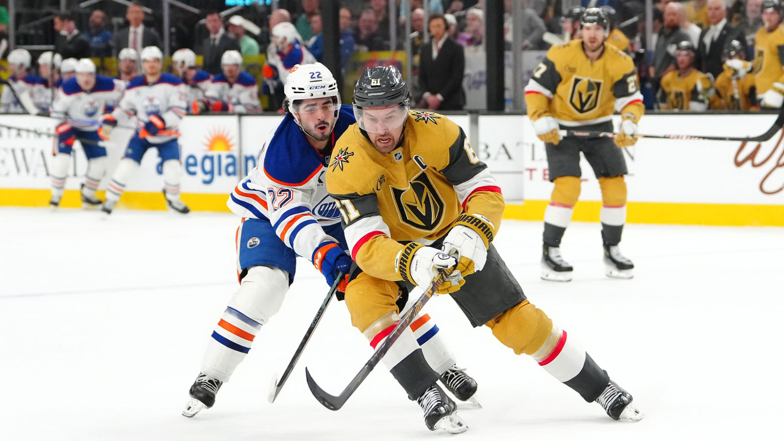 Vegas Golden Knights right wing Mark Stone (61) keeps the puck away from Edmonton Oilers center Matt Savoie (22) during the first period at T-Mobile Arena. 
