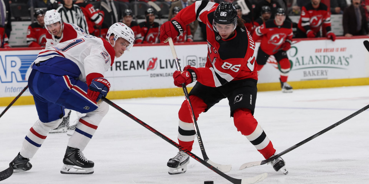Jack Hughes stick handles through Montreal's defense on Saturday night at the Prudential Center.