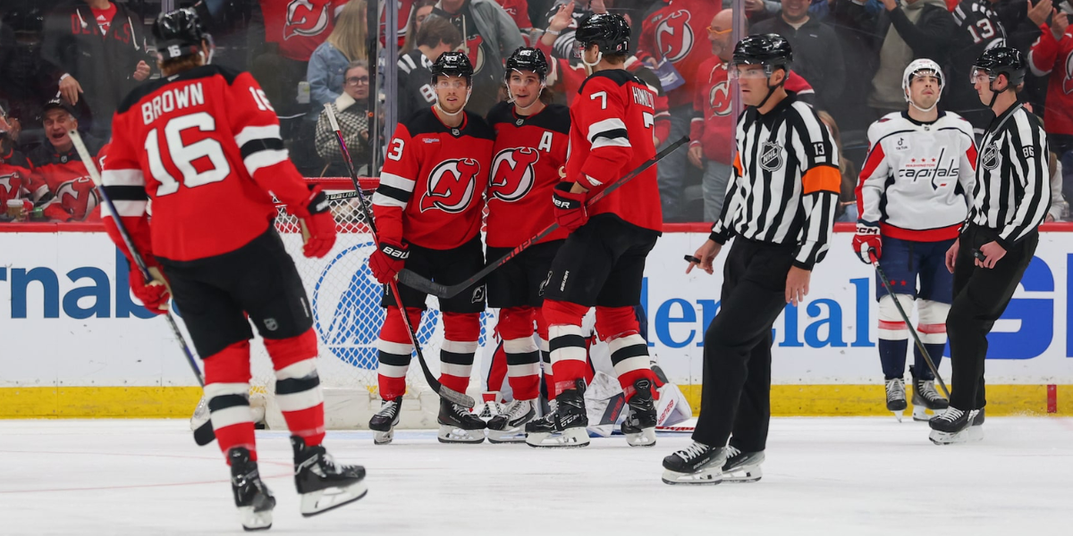 Jack Hughes celebrates his third period goal against the Washington Capitals with teammates Connor Brown, Jesper Bratt and Dougie Hamilton.
