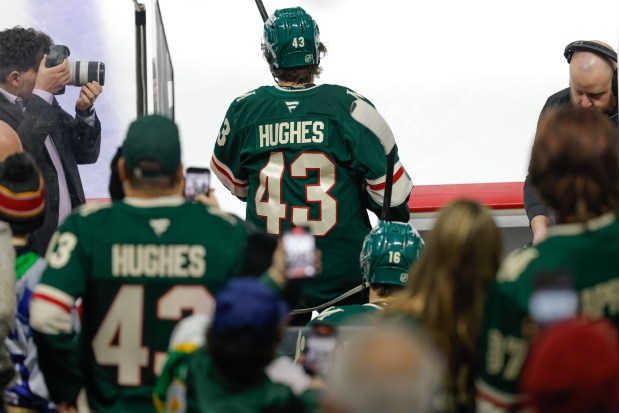 Quinn Hughes steps into the rink.