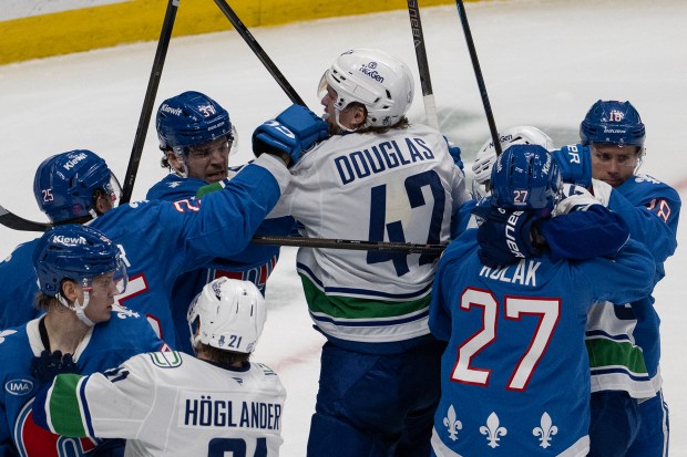 Center Curtis Douglas (42) of the Vancouver Canucks and defenseman Nick Blankenburg (37) of the Colorado Avalanche are at the center of a brawl during the second period on Wednesday, April 1, 2026, at Ball Arena in Denver. (Photo by Timothy Hurst/The Denver Post)
