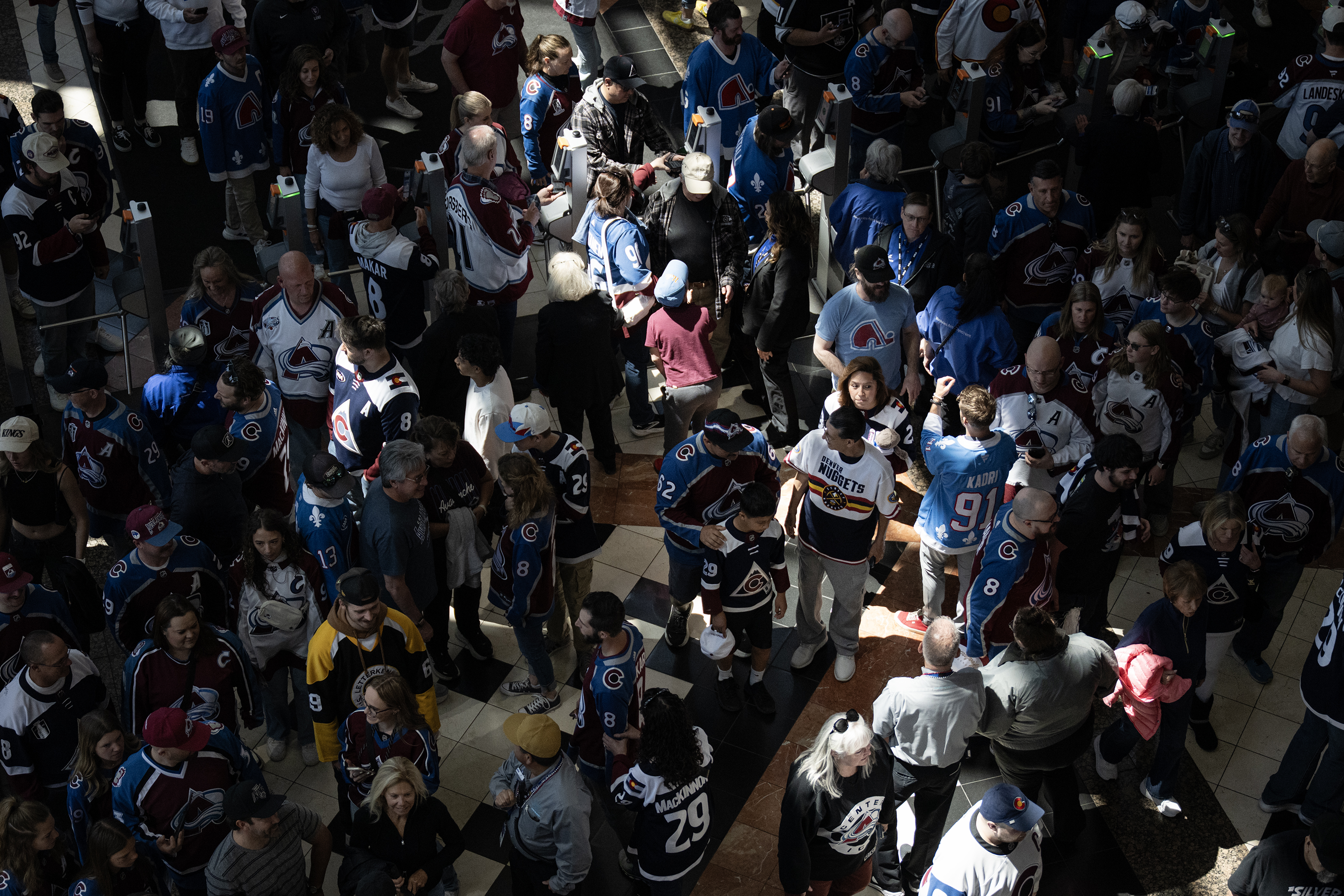Fans stream into the lobby before game one of the...