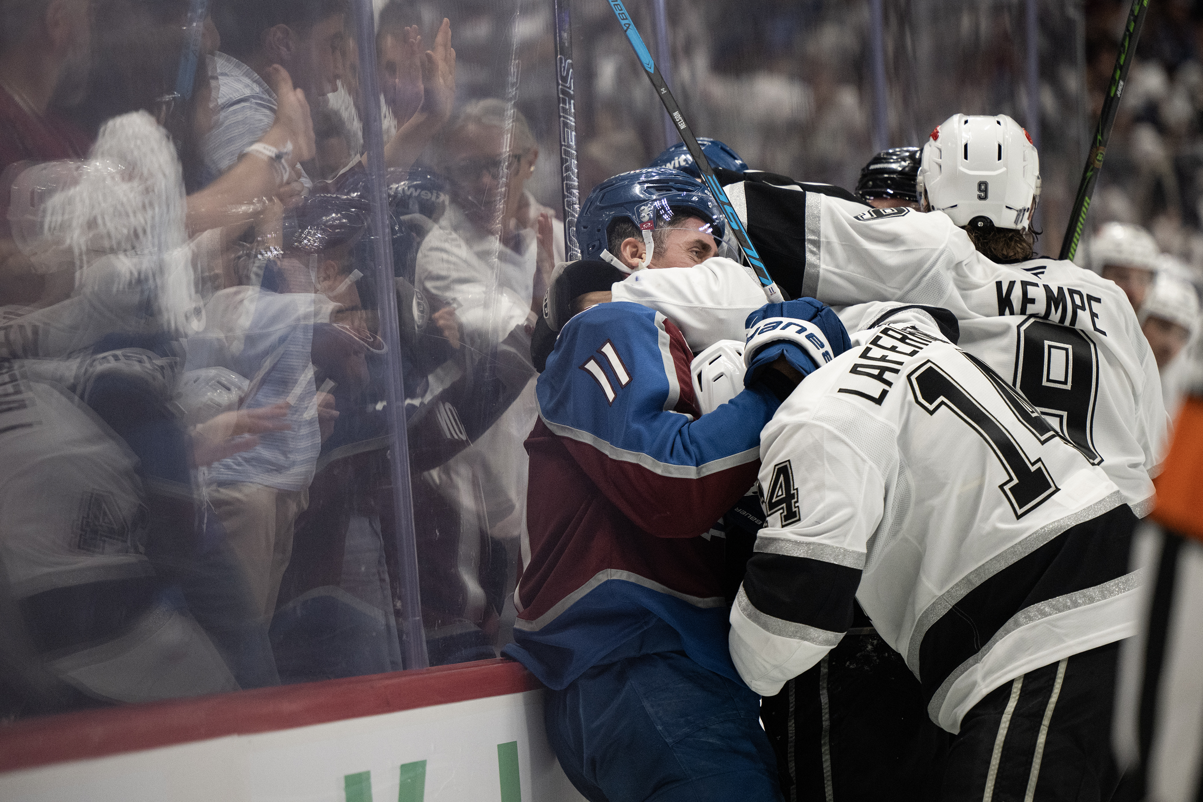 center Brock Nelson (11) of the Colorado Avalanche gets moved...