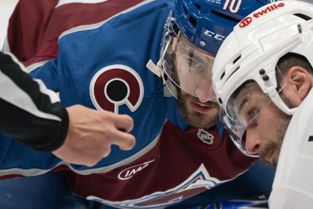 Center Nicolas Roy (10) of the Colorado Avalanche watches for the puck to drop while facing off with center Scott Laughton (21) of the Los Angeles Kings during the third period of game two of the first round of the 2026 Stanley Cup Playoffs on Tuesday, April 21, 2026, at Ball Arena in Denver. (Photo by Timothy Hurst/The Denver Post)