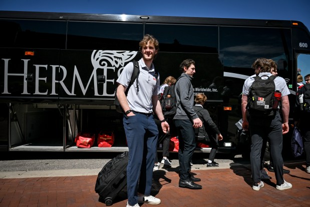 Quentin Miller of the University of Denver Pioneers heads to the bus with teammates for the team's departure from the Ritchie Center en route to Las Vegas to compete in the Frozen Four on Tuesday, April 7, 2026. (Photo by AAron Ontiveroz/The Denver Post)