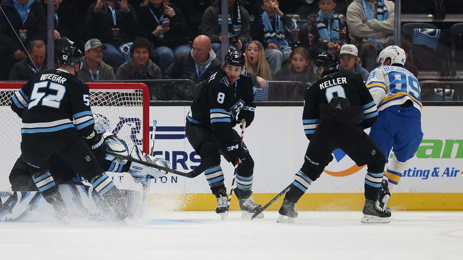 St. Louis Blues left wing Pavel Buchnevich (89) scores a goal against Utah Mammoth center Nick Schmaltz (8), defenseman MacKenzie Weegar (52) and goaltender Karel Vejmelka (70) during the first period at Delta Center.