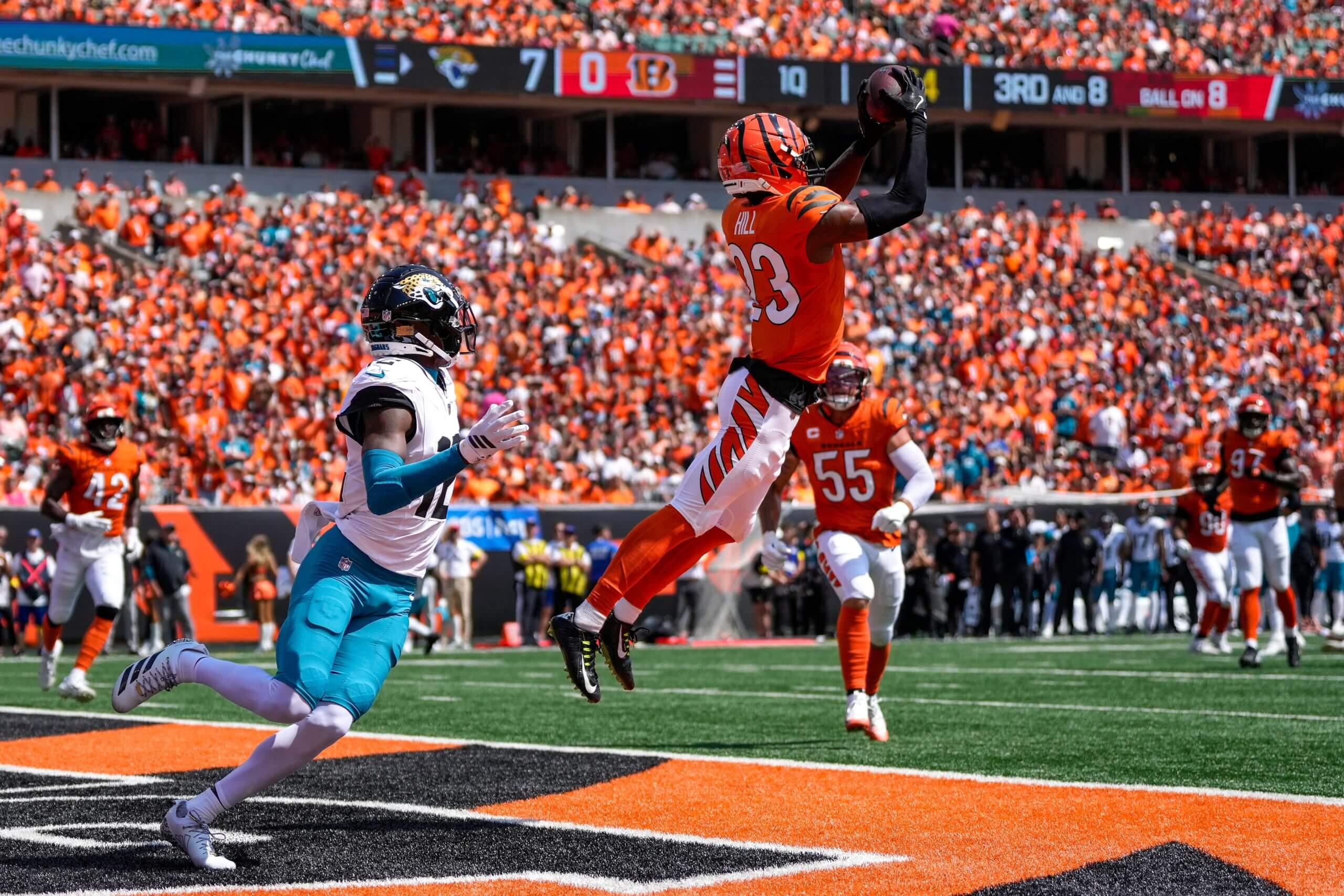 Cincinnati Bengals cornerback Dax Hill (23) intercepts a pass intended for Jacksonville Jaguars wide receiver Travis Hunter (12) in the first quarter of the NFL Week 2 game between the Cincinnati Bengals and the Jacksonville Jaguars at Paycor Stadium in downtown Cincinnati on Sunday, Sept. 14, 2025.