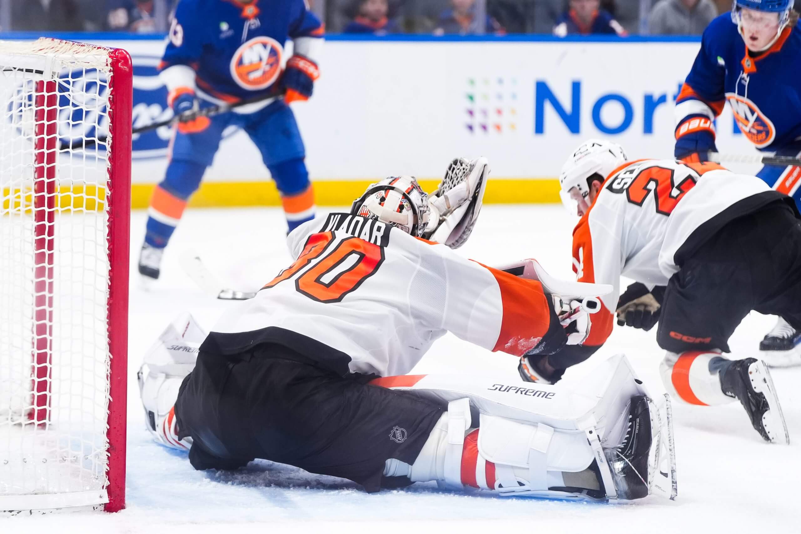 Flyers goaltender Dan Vladar makes a save.