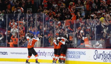 Apr 5, 2026; Philadelphia, Pennsylvania, USA; Philadelphia Flyers right wing Porter Martone (94) celebrates with teammates after scoring a goal against the Boston Bruins in overtime at Xfinity Mobile Arena.