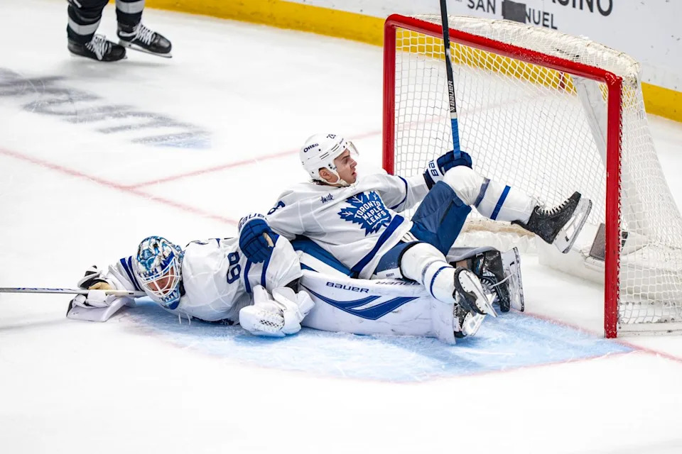 Toronto Maple Leafs goalie Joseph Woll (60) and defenseman Troy Stecher (28) falling at their goal during an NHL hockey game against the Los Angeles Kings on April 4th, 2026 in Los Angeles, CA.