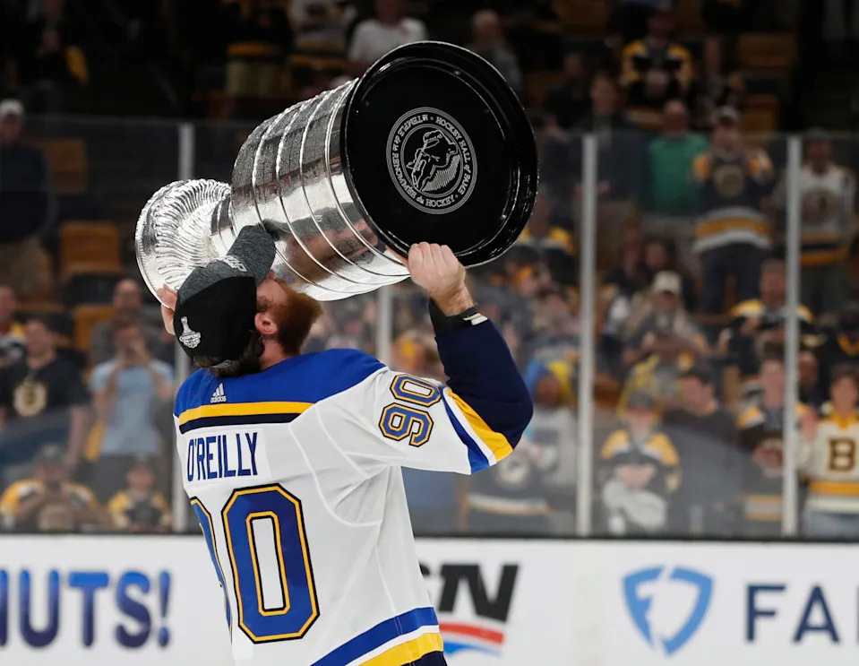 Jun 12, 2019; Boston, MA, USA; St. Louis Blues center Ryan O'Reilly (90) kisses the Stanley Cup after defeating the Boston Bruins in game seven of the 2019 Stanley Cup Final at TD Garden. Mandatory Credit: Winslow Townson-Imagn Images