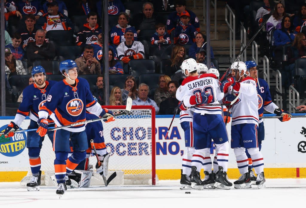 Nick Suzuki #14 of the Montréal Canadiens celebrates his goal and 100th point of the season at 15:46 of the second period against the New York Islanders at UBS Arena on April 12, 2026 in Elmont, New York. Getty Images