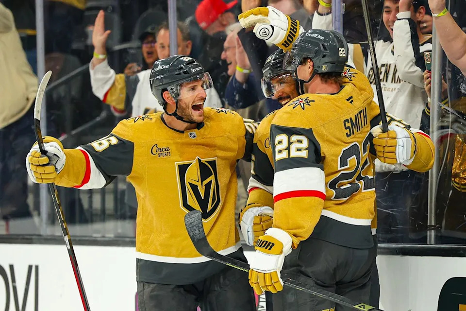 Vegas Golden Knights F Cole Smith (22) celebrates with his teammates after scoring an empty net goal against the Vancouver Canucks on Monday, March 30, 2026, in Las Vegas, Nevada.