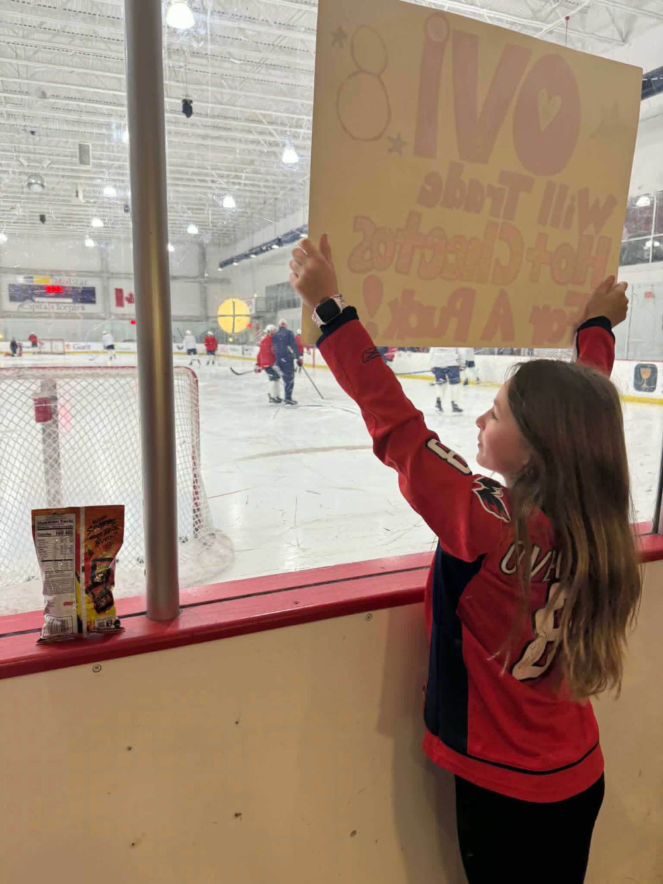 Cambree holding up sign