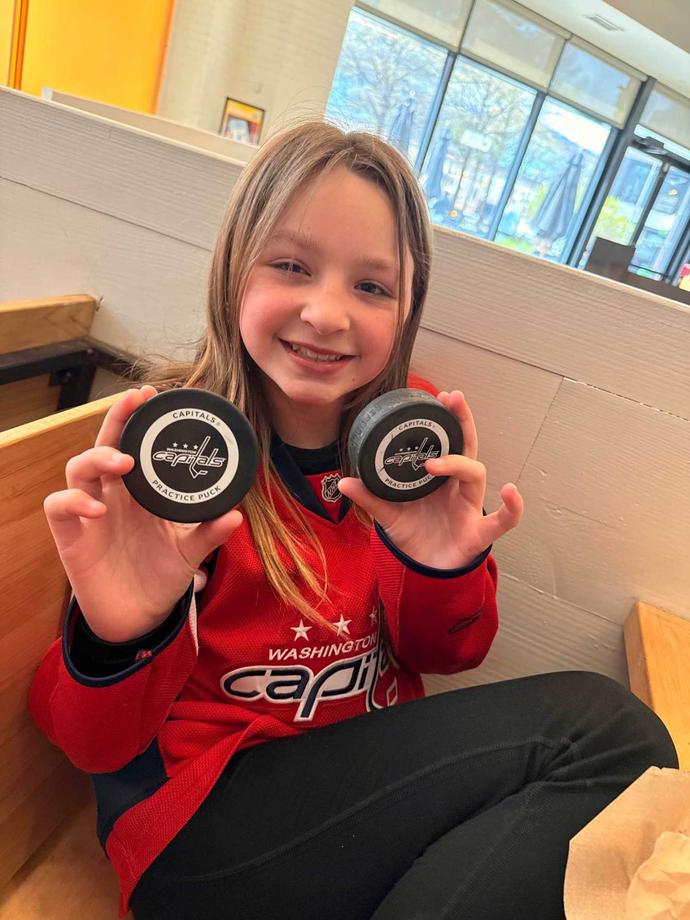 Cambree holds up Capitals practice pucks