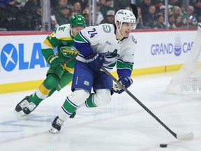 Zeev Buium skates with the puck ahead of Minnesota Wild left wing Matt Boldy during the first period of the game on Thursday, April 2, 2026.