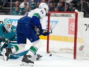 San Jose Sharks goaltender Yaroslav Askarov looks back as Vancouver Canucks left wing Jake DeBrusk scores a goal on Saturday, April 11, 2026.