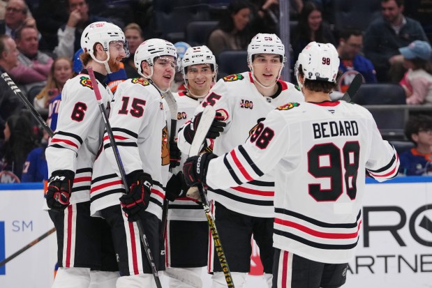 Chicago Blackhawks' Ilya Mikheyev celebrates with teammates Sam Rinzel, Anton Frondell, Connor Bedard and Wyatt Kaiser after scoring a goal during the first period of a game Tuesday, March 24, 2026, in Elmont, N.Y. (AP Photo/Frank Franklin II)