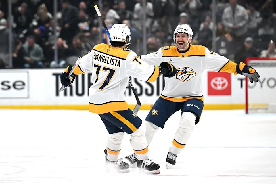 Apr 2, 2026; Los Angeles, California, USA; Nashville Predators right wing Luke Evangelista (77) celebrates with Nashville Predators left wing Filip Forsberg (9) after winning the penalty shootout against the Los Angeles Kings at Crypto.com Arena. Mandatory Credit: Griffin Hooper-Imagn Images