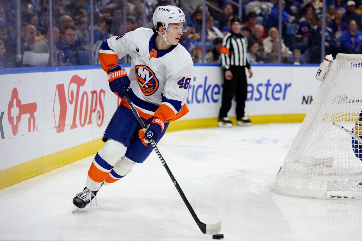 New York Islanders defenseman Matthew Schaefer (48) making a pass during a game against the Buffalo Sabres.