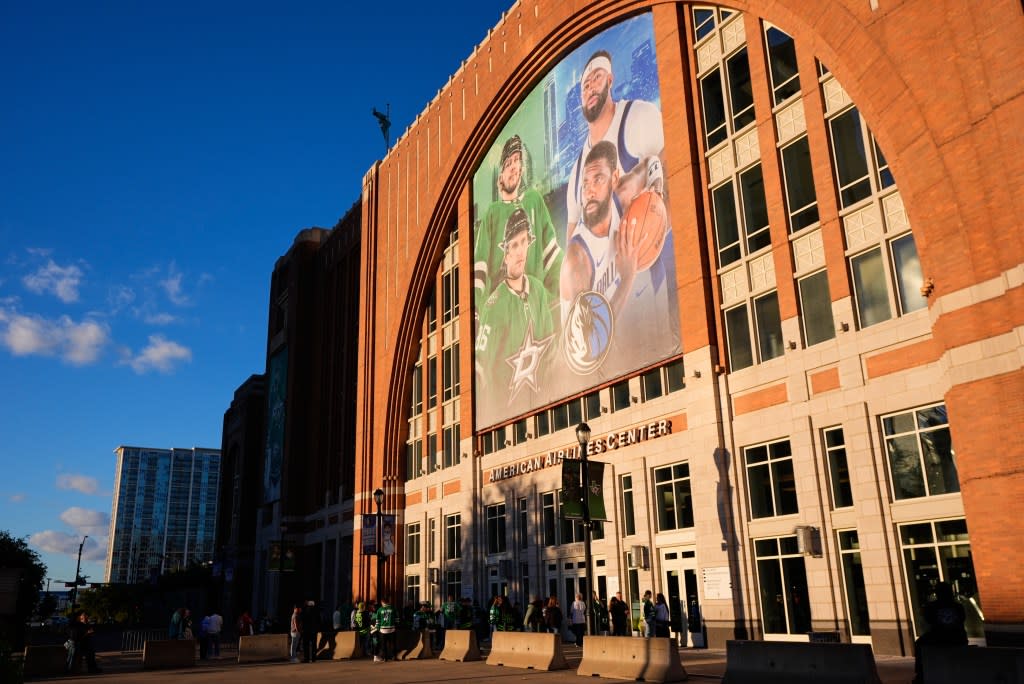 Fans line up outside the doors of American Airlines Center before the start of an NHL hockey game in Dallas, on Tuesday, Oct. 28, 2025 AP