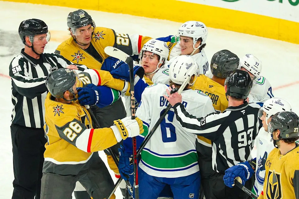 Multiple players for the Vegas Golden Knights and Vancouver Canucks tussle in front of the Vegas Golden Knights net during an NHL game on Monday, March 30, 2026, in Las Vegas, Nevada.