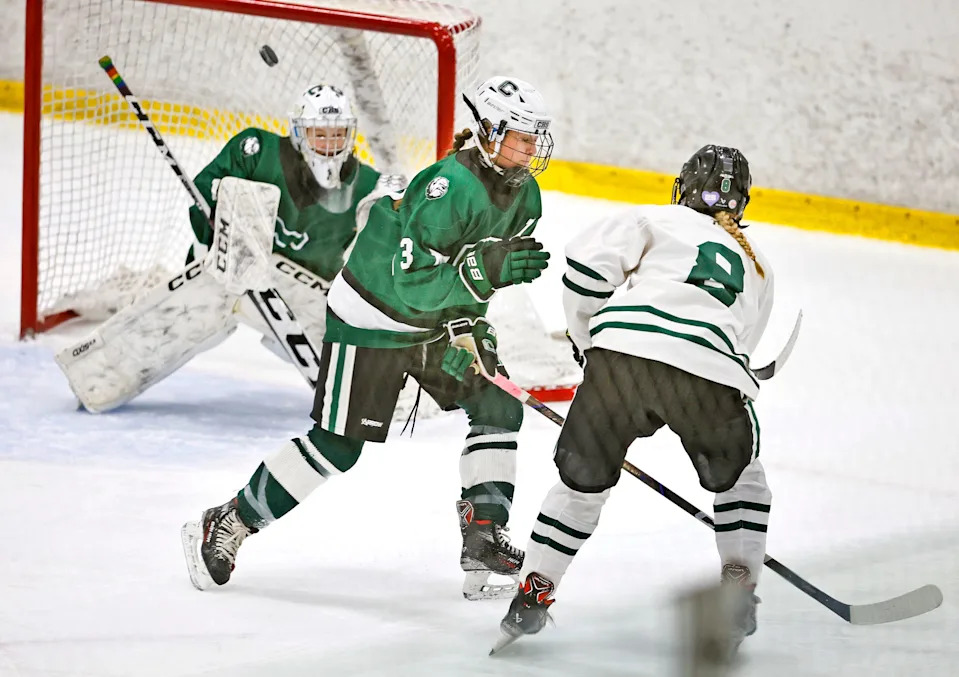Dragon #8 Addy Harrington gets a shot on Canton's net past defender Grace Donahue and over goalie Charlotte Eagles.
The Duxbury Dragons hosted the Canton Bulldogs in girls hockey at The Bog in Kingston on Monday, Jan. 12, 2026.
