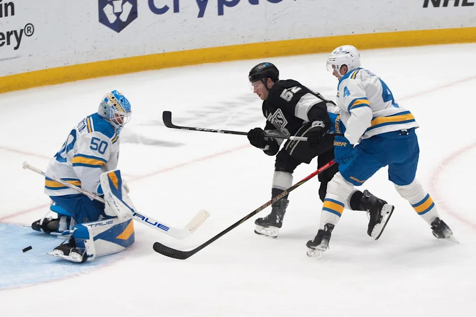 Los Angeles Kings Right Wing Taylor Ward (52) gets by his defender and attempts a shot on goal during an NHL match against the St. Louis Blues on April 1st, 2026 in Los Angeles, California.