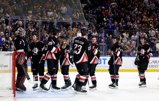 The Sabres celebrate an Atlantic Division victory over the Boston Bruins.