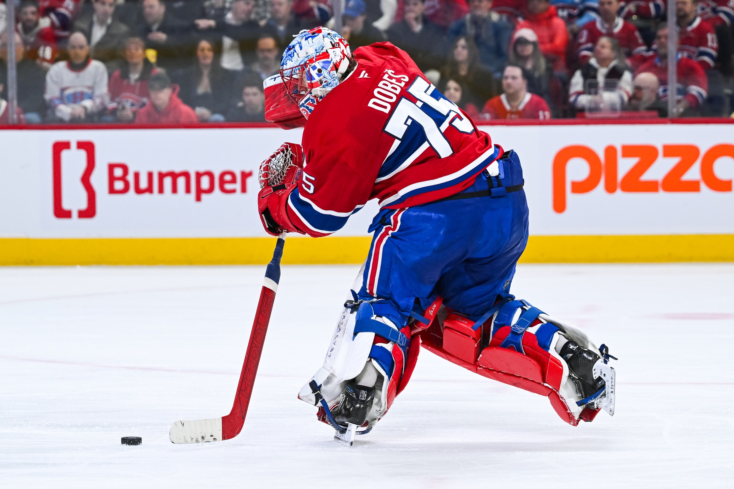 MONTREAL, QC - APRIL 09: Montreal Canadiens goalie Jakub Dobes (75) intercepts the puck during the Tampa Bay Lightning versus the Montreal Canadiens game on April 09, 2026, at Bell Centre in Montreal, QC (Photo by David Kirouac/Icon Sportswire via Getty Images)