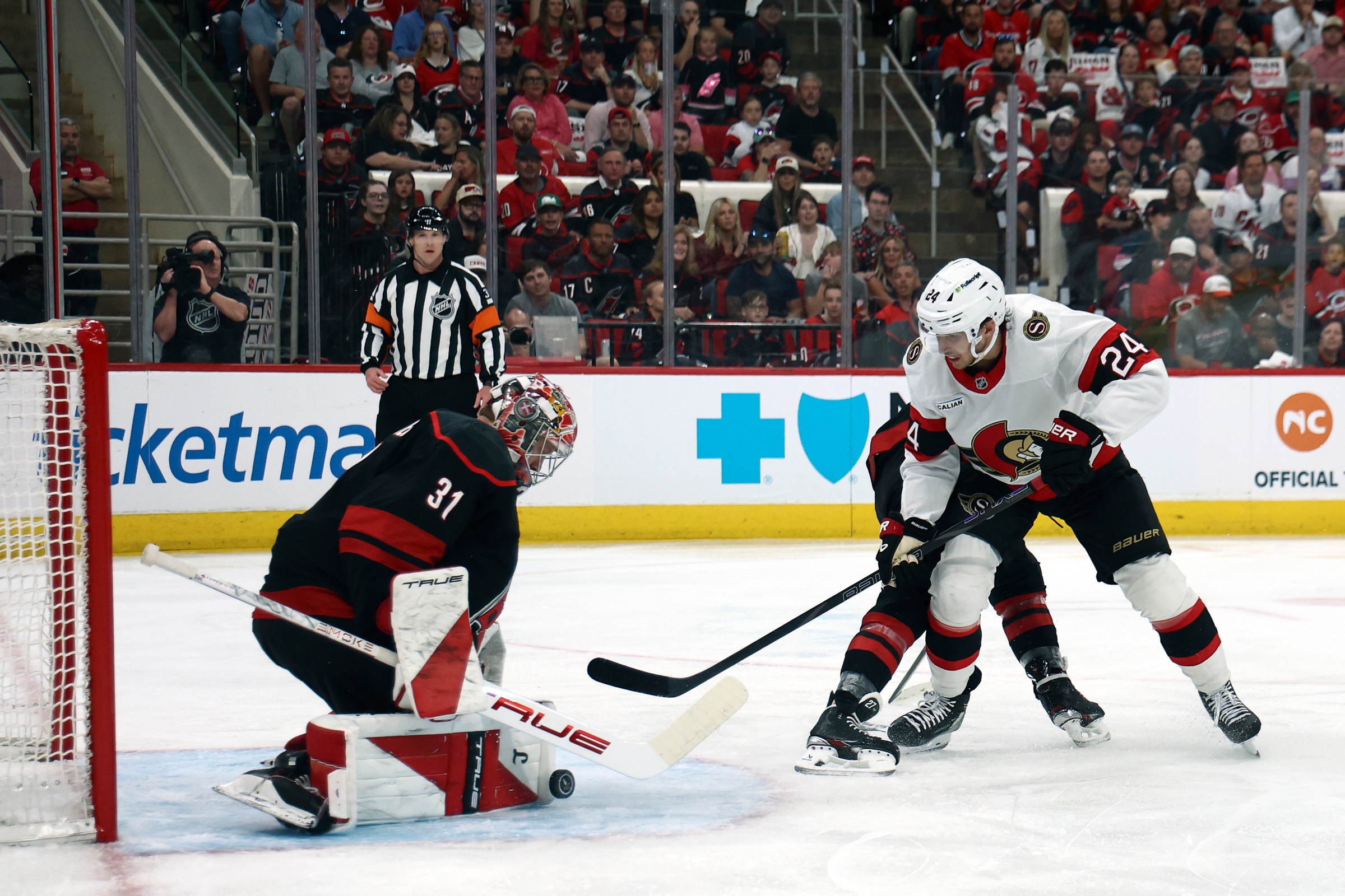 RALEIGH, NORTH CAROLINA - APRIL 18: Dylan Cozens #24 of the Ottawa Senators attempts a shot against Frederik Andersen #31 of the Carolina Hurricanes during the first period of the game at Lenovo Center on April 18, 2026 in Raleigh, North Carolina. (Photo by Jared C. Tilton/Getty Images)
