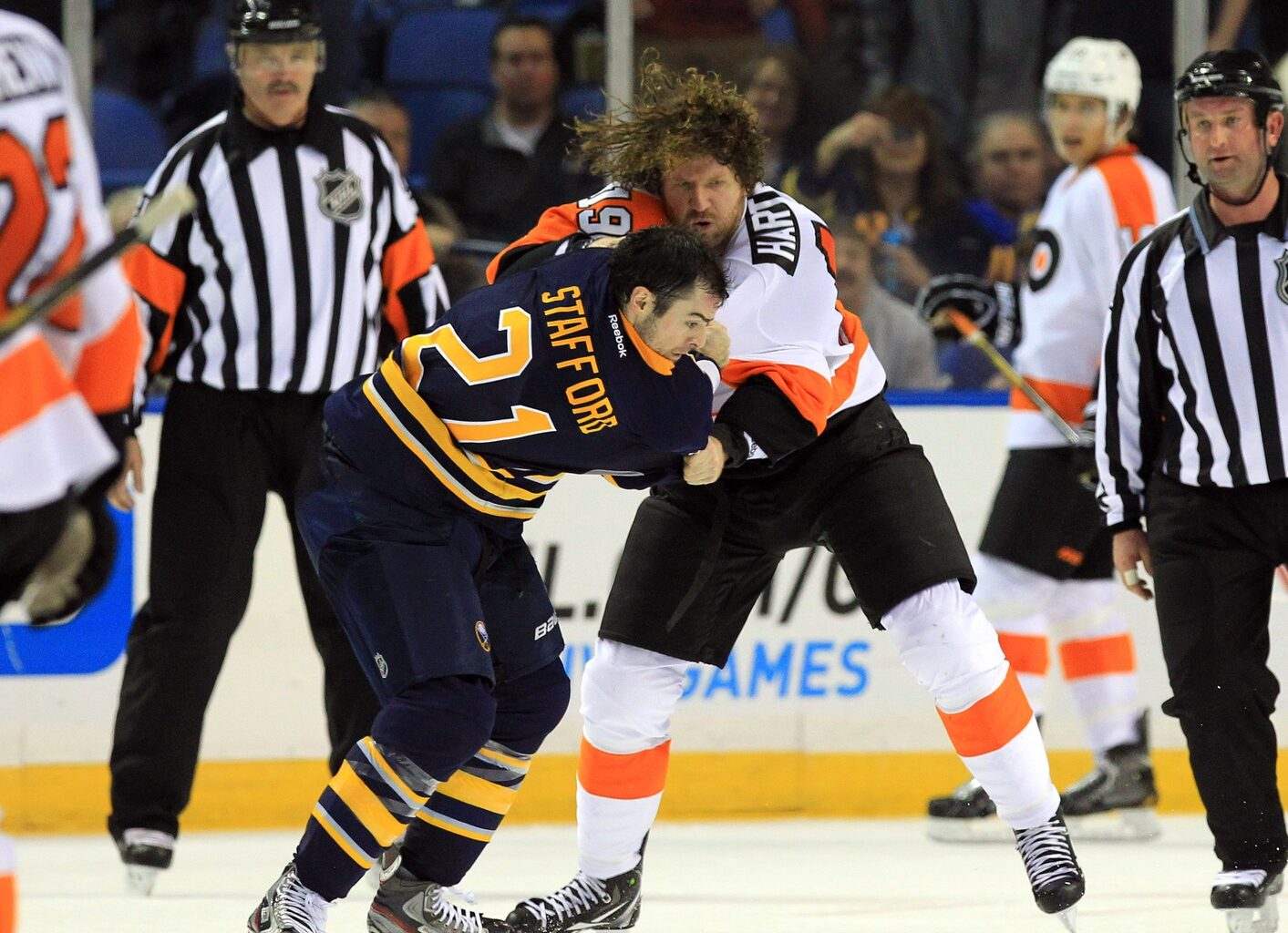 Jan 20, 2013; Buffalo, NY, USA; Philadelphia Flyers right wing Scott Hartnell (19) and Buffalo Sabres right wing Drew Stafford (21) fight during the second period at the First Niagara Center.