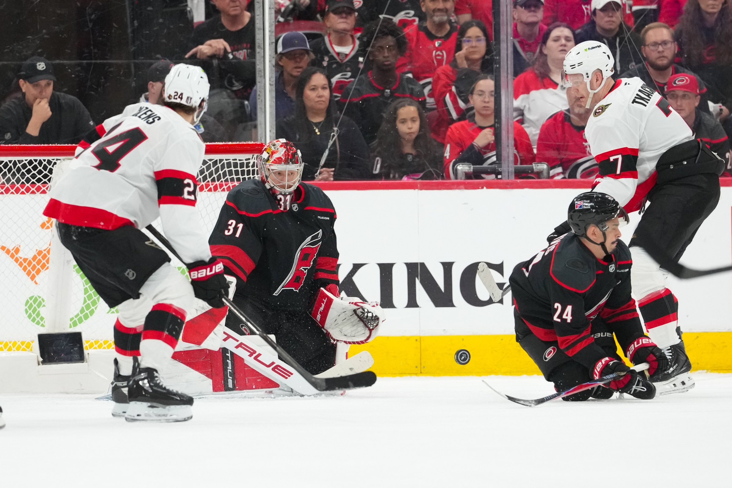 Apr 18, 2026; Raleigh, North Carolina, USA; Carolina Hurricanes center Seth Jarvis (24) with goaltender Frederik Andersen (31) go to block the shot by Ottawa Senators left wing Brady Tkachuk (7) during the third period in game one of the first round of the 2026 Stanley Cup Playoffs at Lenovo Center. Mandatory Credit: James Guillory-Imagn Images