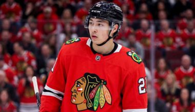 Detailed composite photo of Dallas Stars superstar forward Jason Robertson in a Chicago Blackhawks red home jersey with number 21, on the ice in a packed United Center during a game, illustrating an NHL trade rumor.