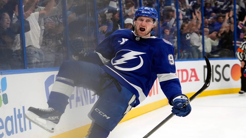 Tampa Bay Lightning defenseman J.J. Moser (90) celebrates after scoring the game-winning goal against the Montréal Canadiens during overtime in Game 2 of an NHL hockey Stanley Cup first-round playoff series, Tuesday, April 21, 2026, in Tampa, Fla. (AP Photo/Chris O'Meara)