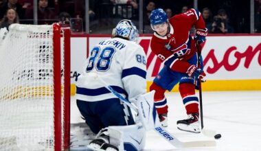 Tampa Bay Lightning goaltender Andrei Vasilevskiy (88) makes a save on Montreal Canadiens' Cole Caufield (13) during the first period of an NHL game, in Montreal, Thursday, April 9, 2026. (Christopher Katsarov/The Canadian Press via AP)